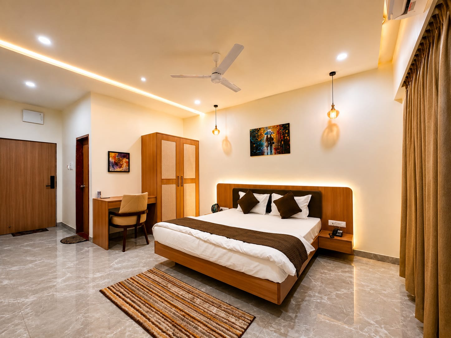 An air-conditioned suite with a king bed, wooden headboard, pendant lights and marble flooring