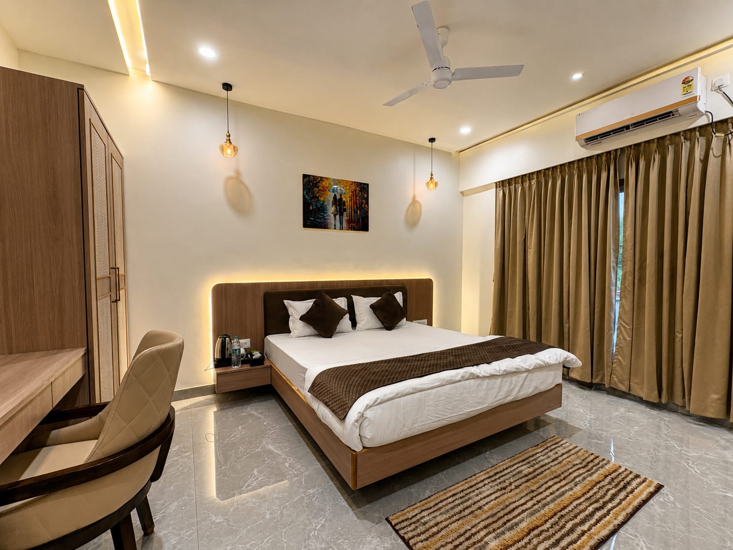 Deluxe Room with king bed, wardrobe and writing desk