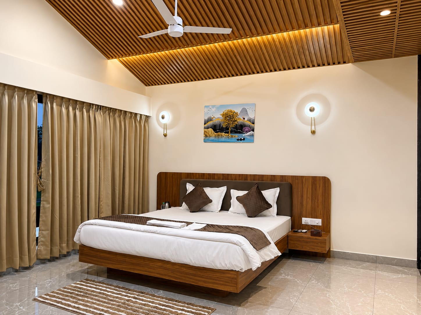 Premium Luxury Suite king bed under the vaulted wood-slat ceiling