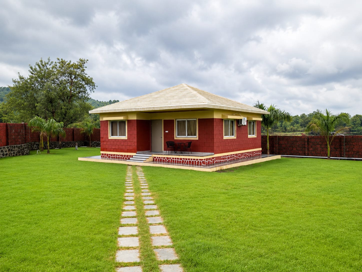 The villa with its stepped veranda on a private lawn